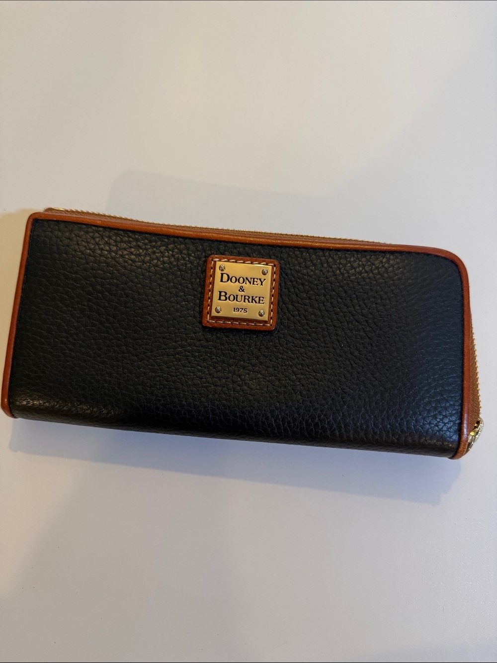 Dooney & Bourke Black Pebbled Leather Zip Wallet with Brown Trim